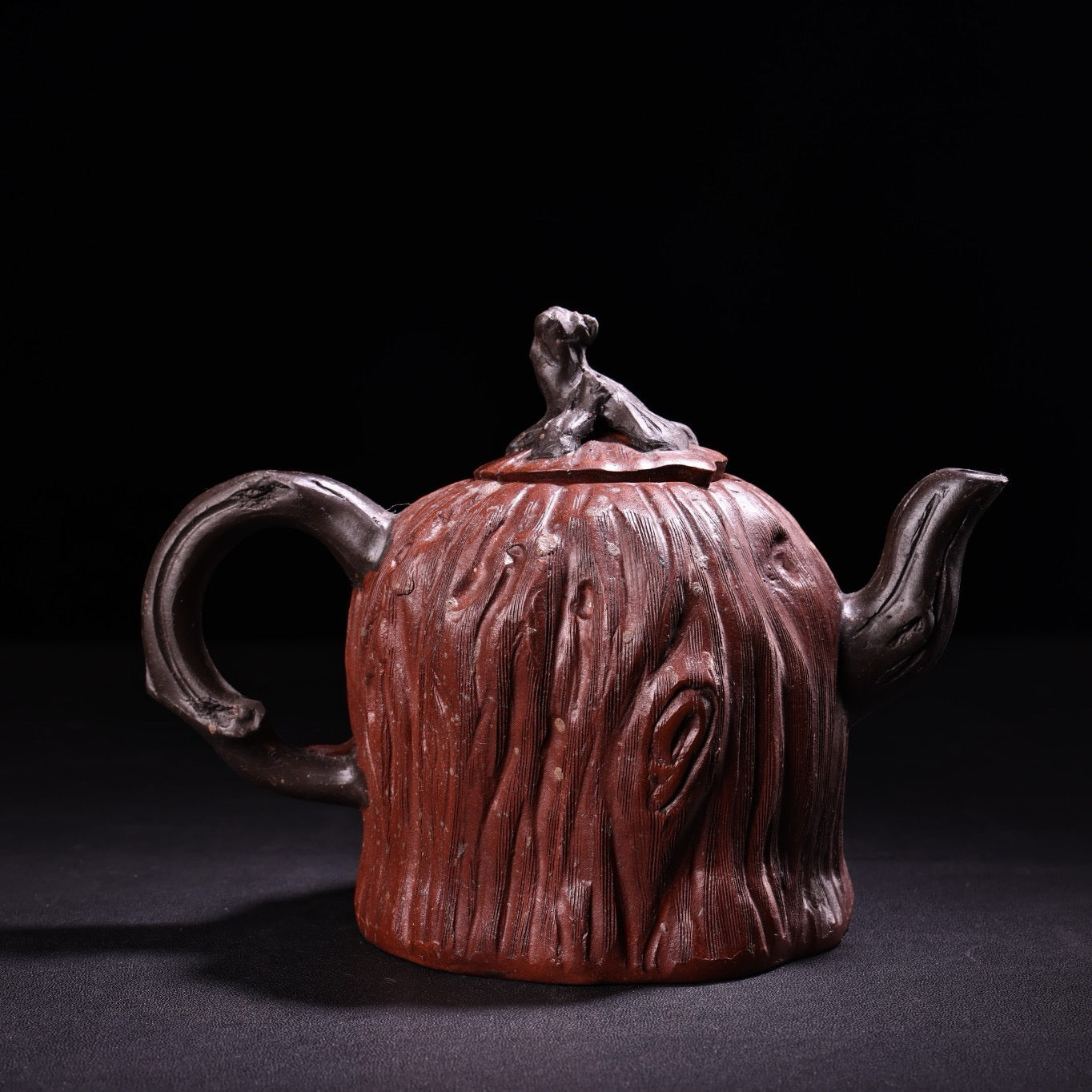 A red clay and purple clay teapot
