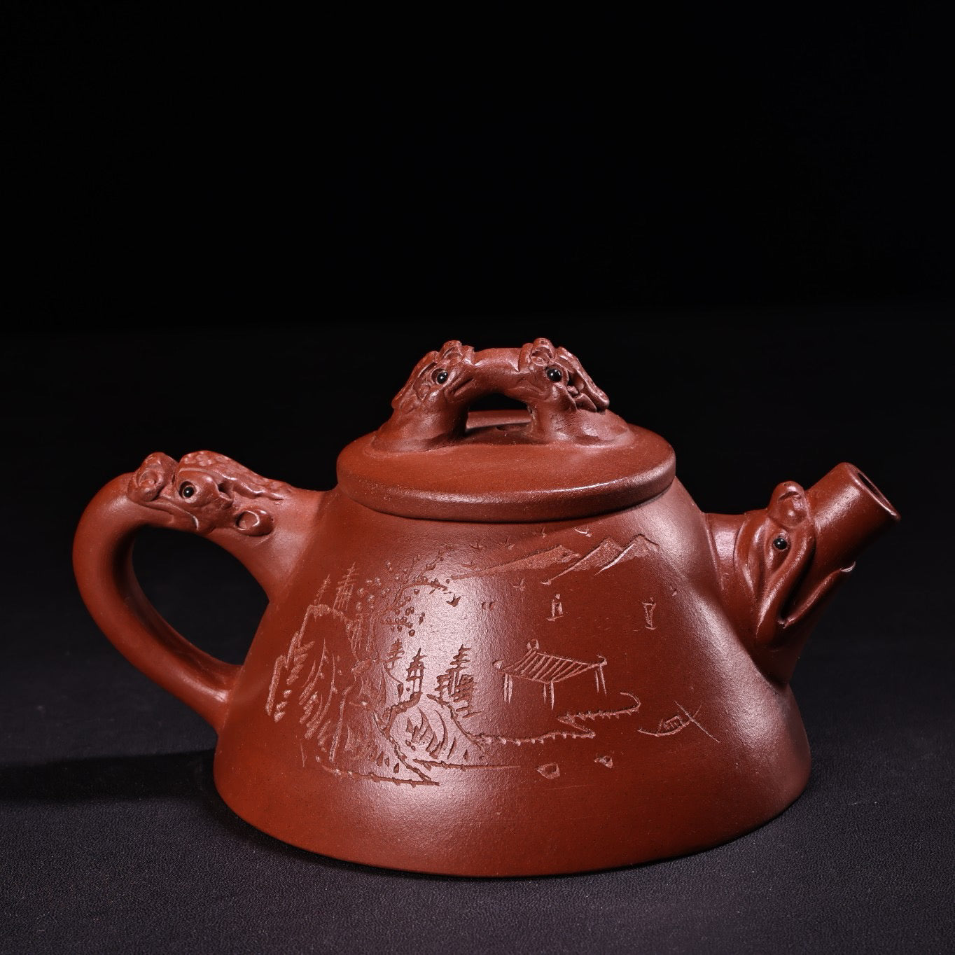 A red clay and purple clay teapot