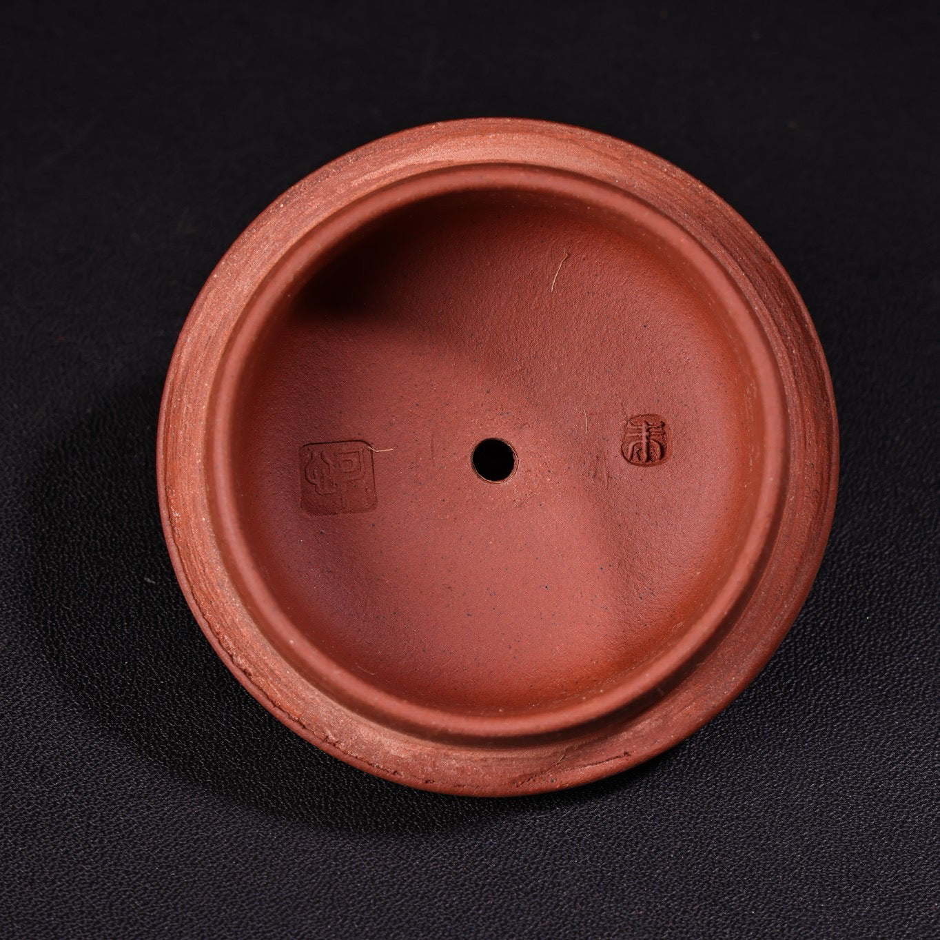 A red clay and purple clay teapot