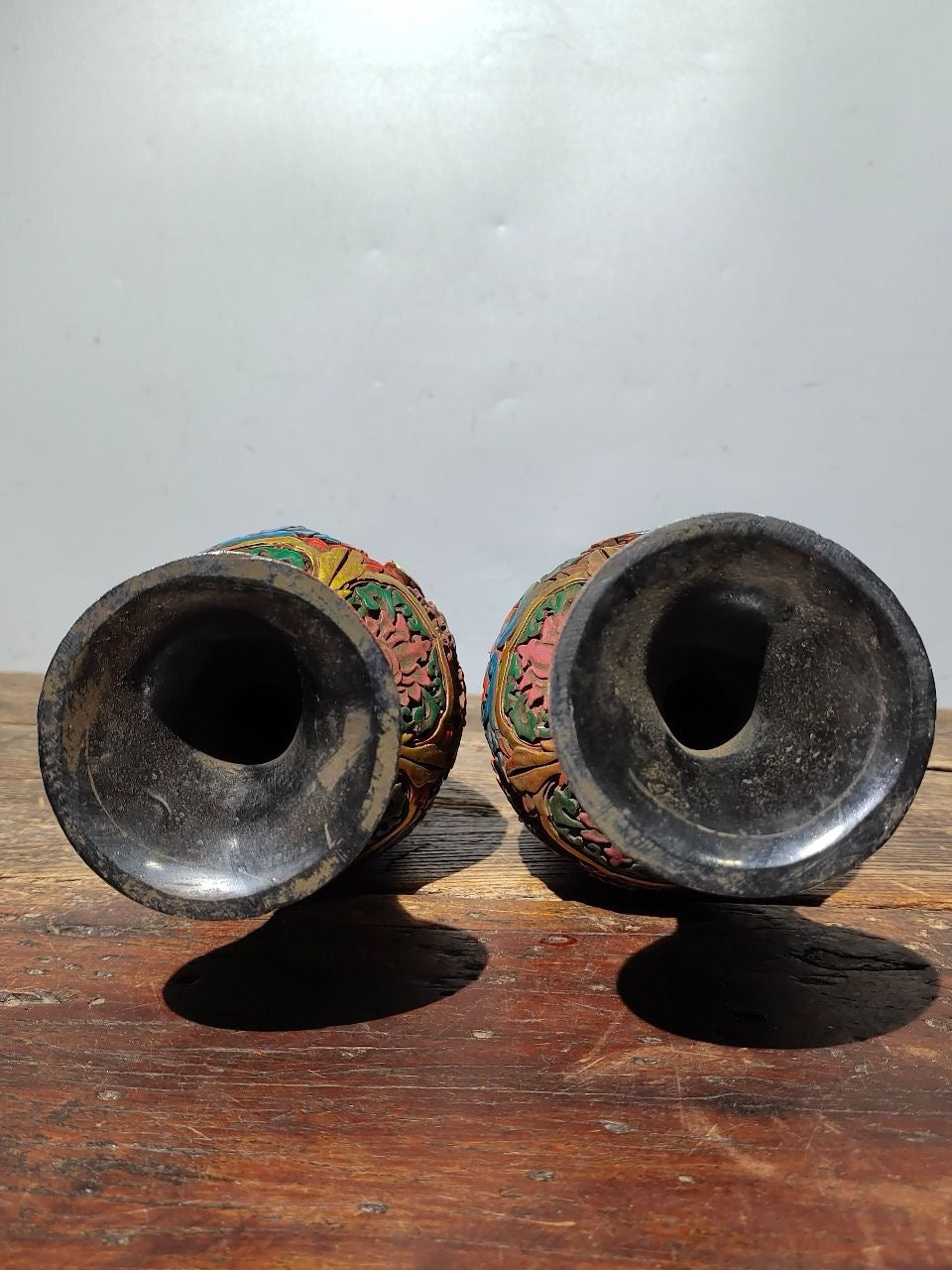 A pair of red lacquerware bottles