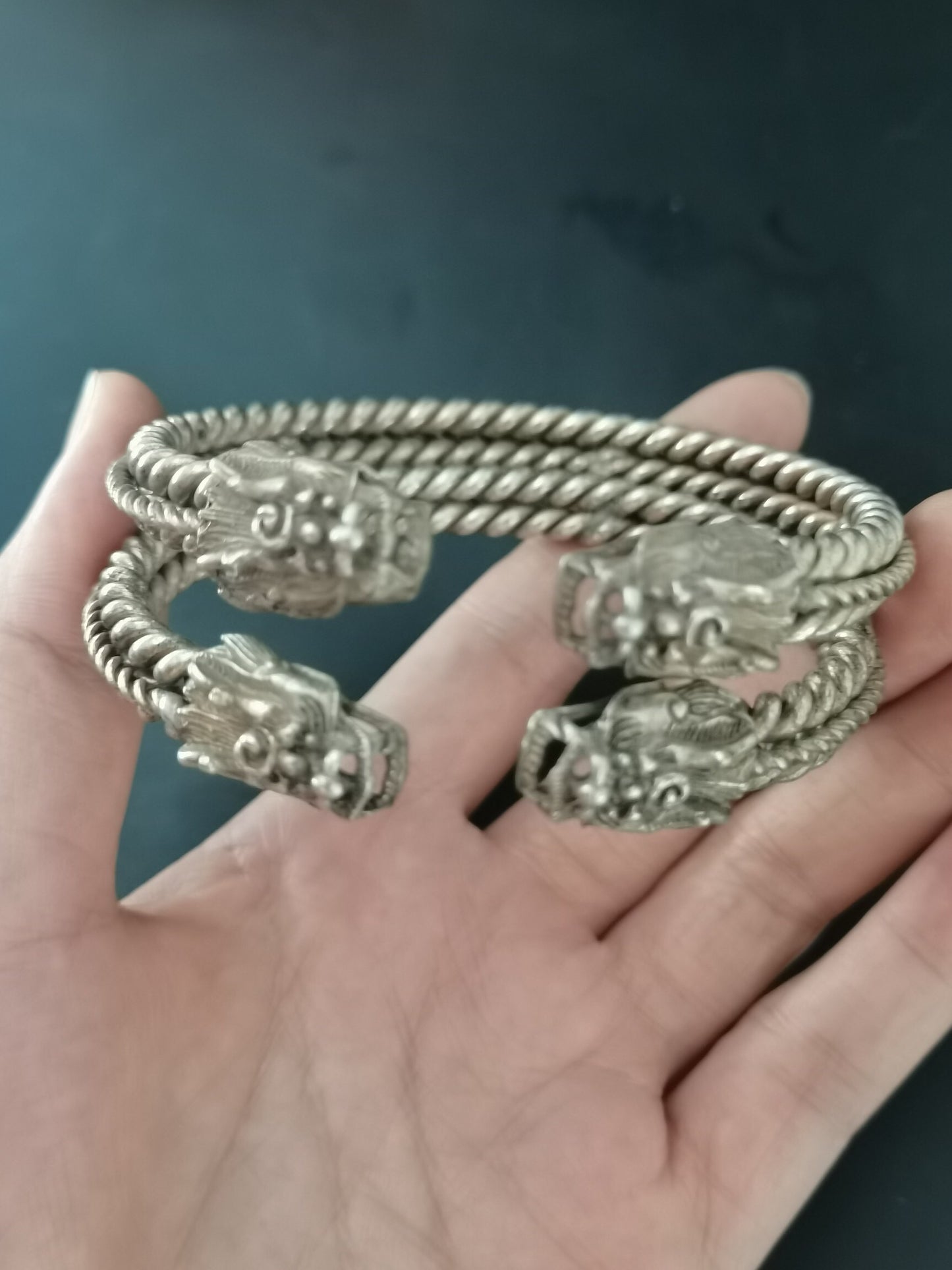 A pair of Chinese antique silver dragon head bracelets