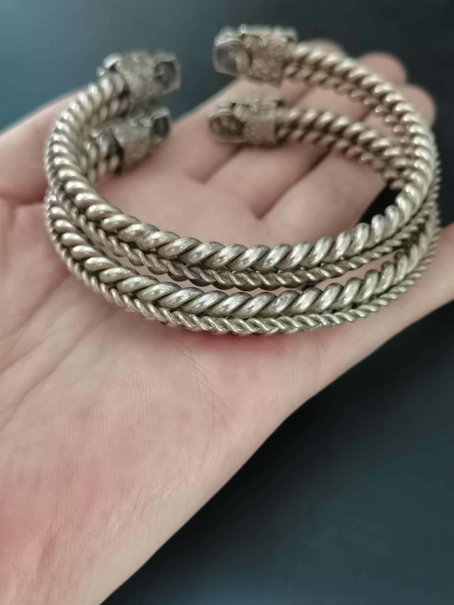 A pair of Chinese antique silver dragon head bracelets