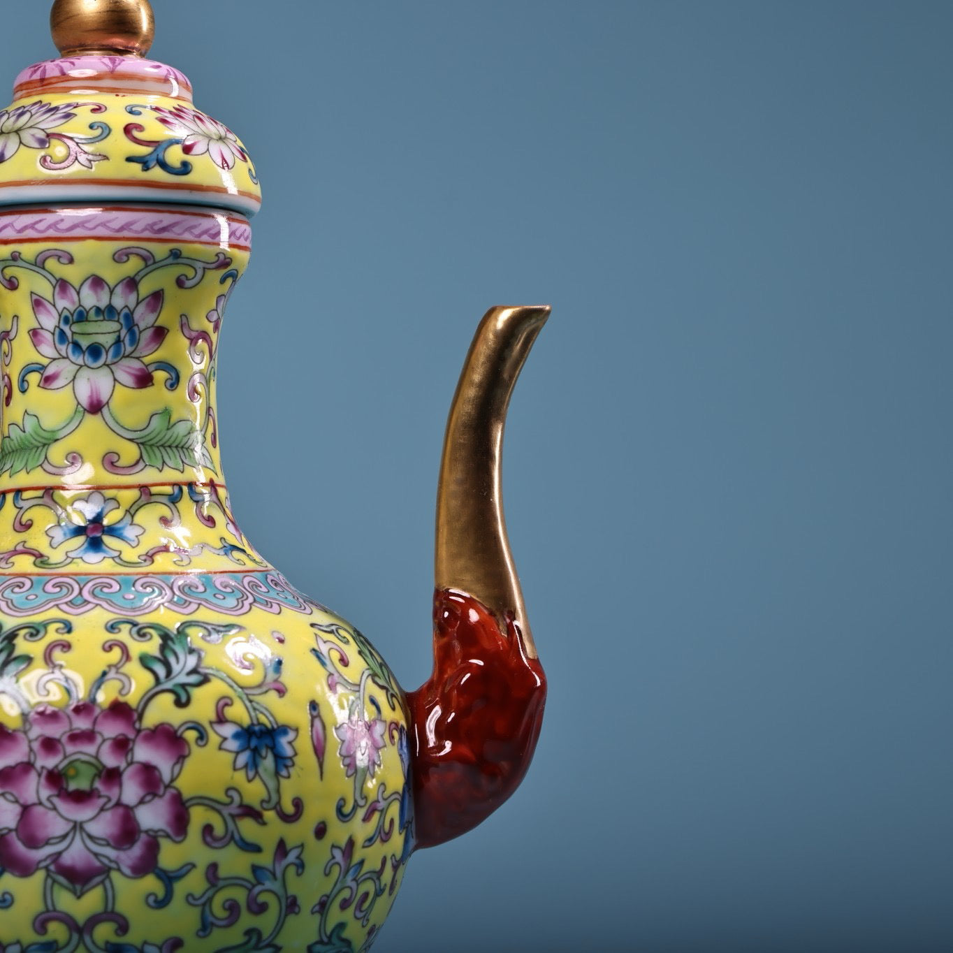 Hand painted enamel gilded gold colored porcelain teapot