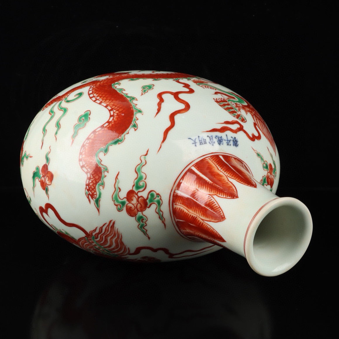 Red and green colored cloud dragon patterned flat bottle