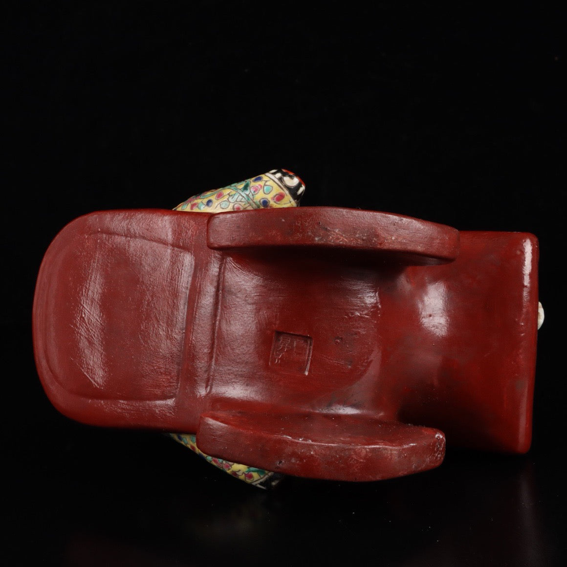 Pink rocking chair with big belly Buddha