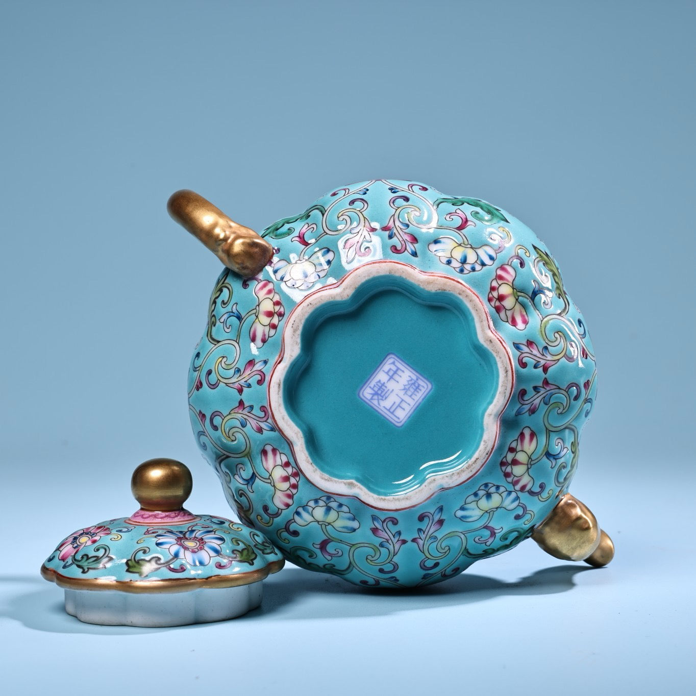 Enamel gilded gold colored porcelain teapot
