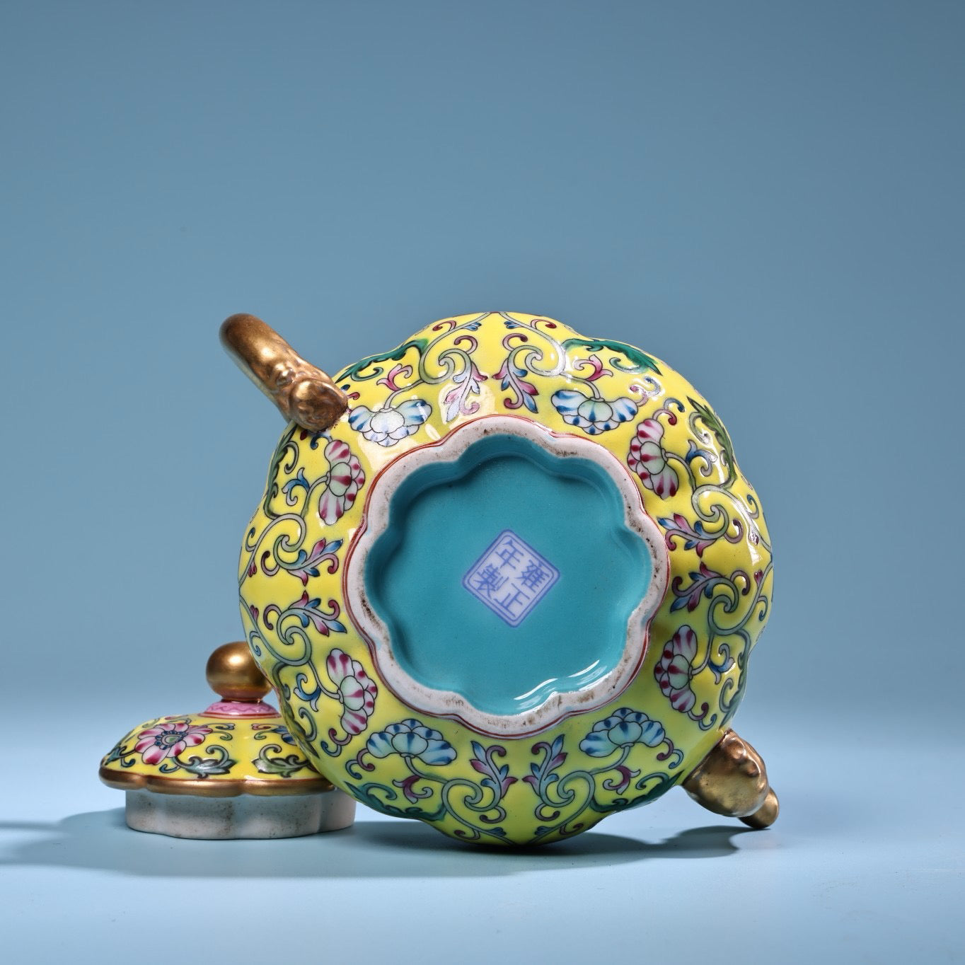 Enamel gilded gold colored porcelain teapot