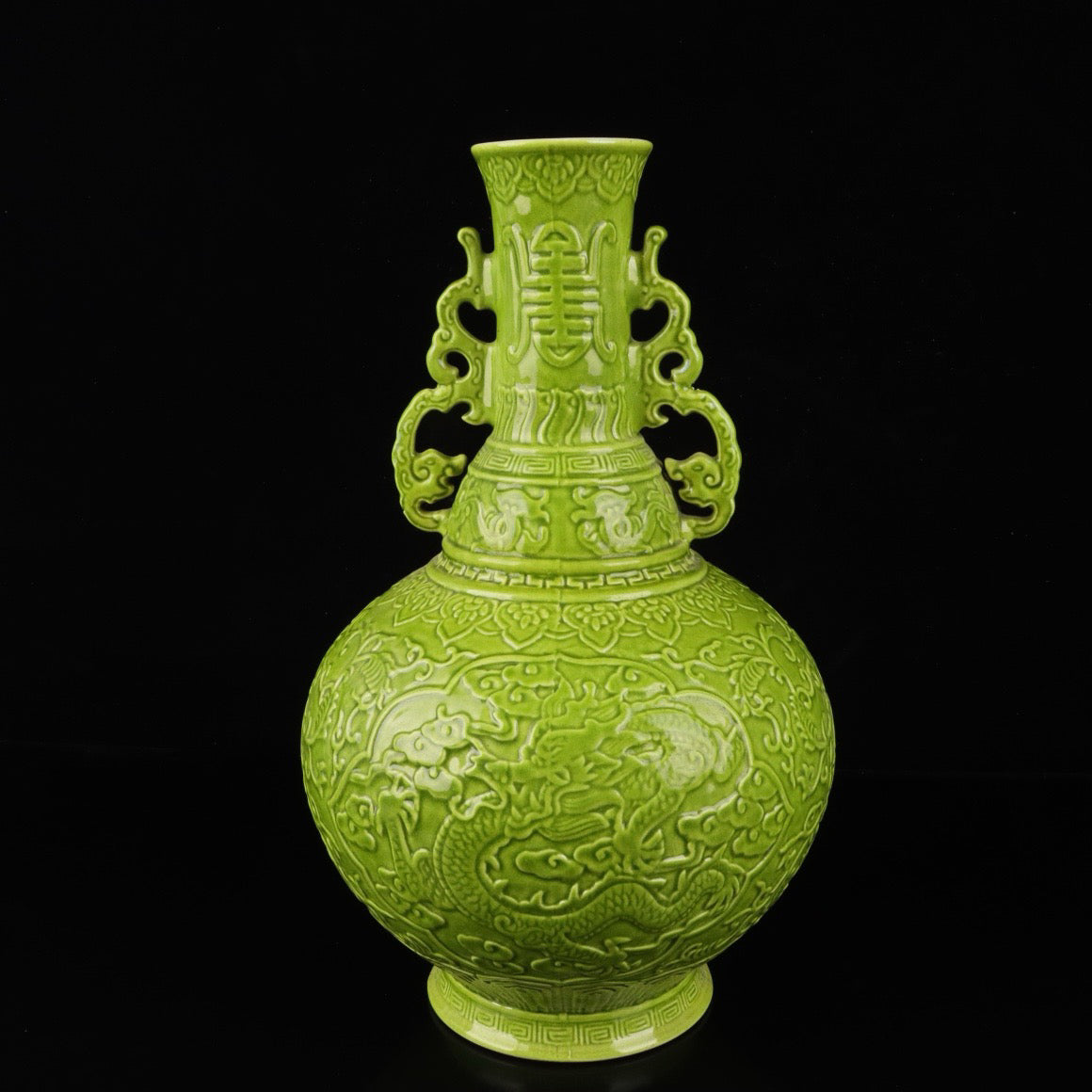 A pair of monochrome glazed relief cloud dragon patterned double ear bottles