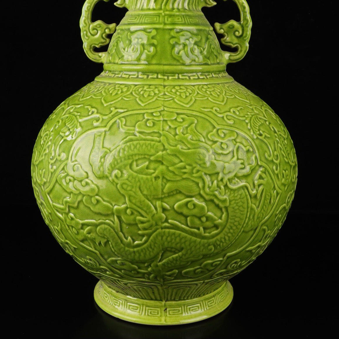 A pair of monochrome glazed relief cloud dragon patterned double ear bottles