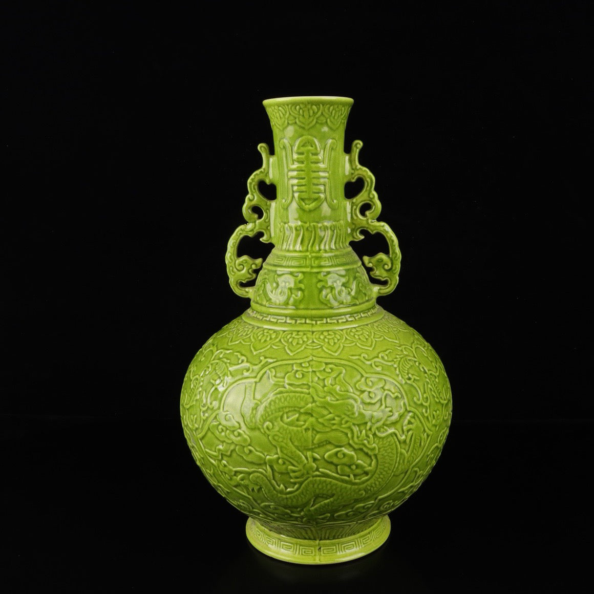 A pair of monochrome glazed relief cloud dragon patterned double ear bottles