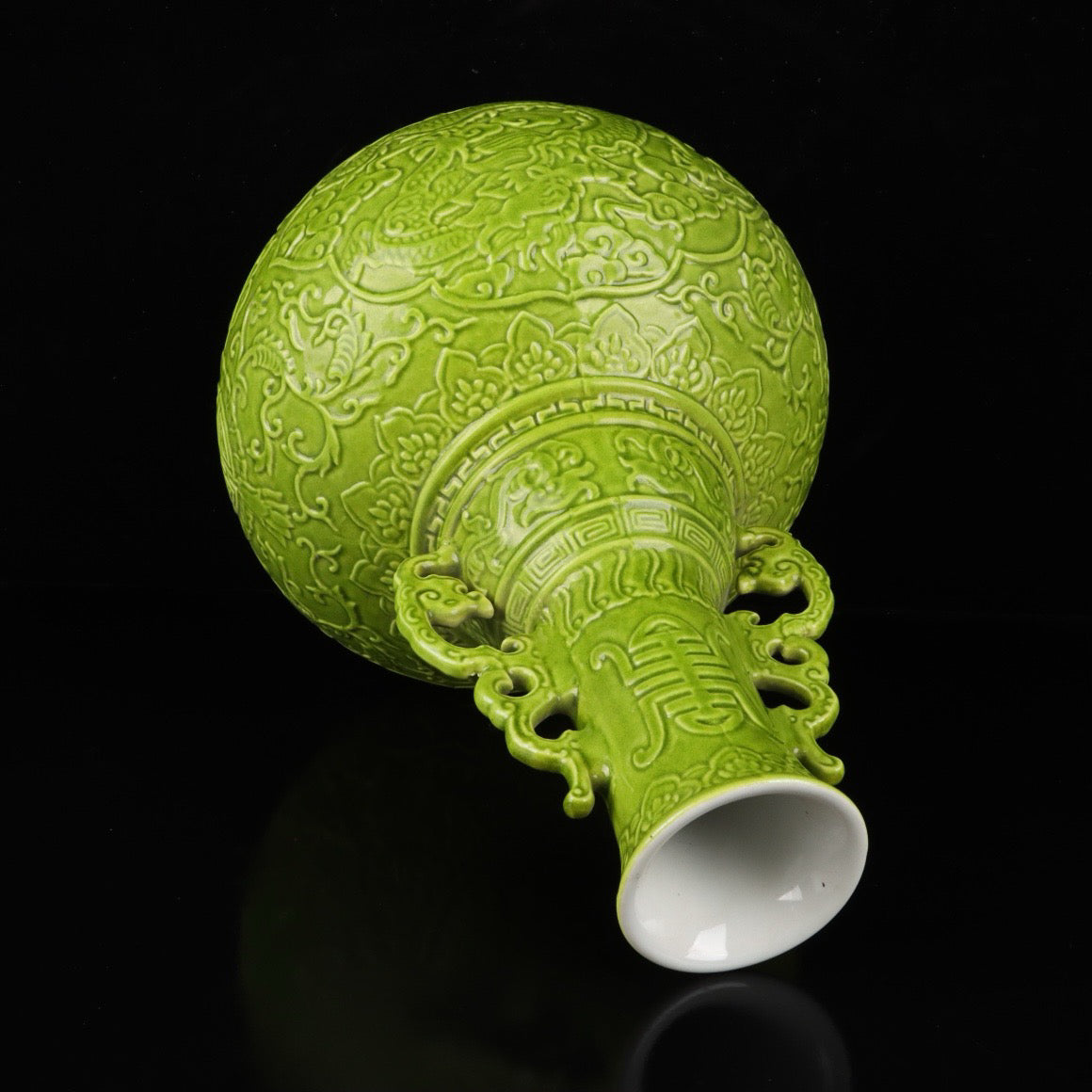 A pair of monochrome glazed relief cloud dragon patterned double ear bottles