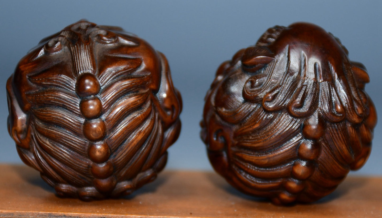 Collection of boxwood carved lion pairs of decorative health balls