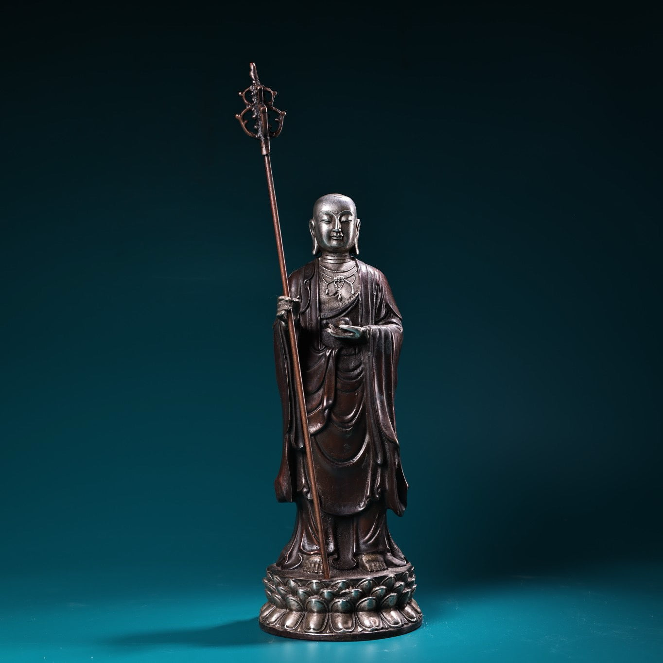 A pure copper high relief carved and gilded silver statue of the Ksitigarbha Bodhisattva