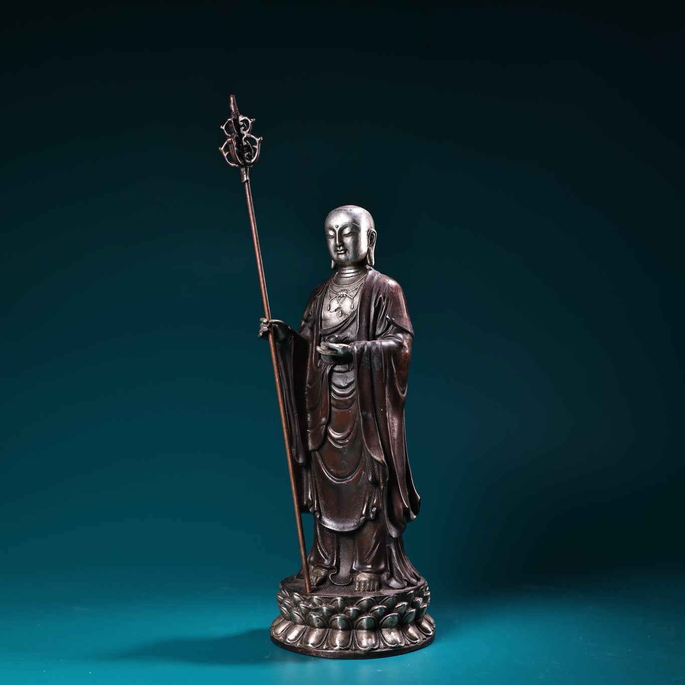A pure copper high relief carved and gilded silver statue of the Ksitigarbha Bodhisattva