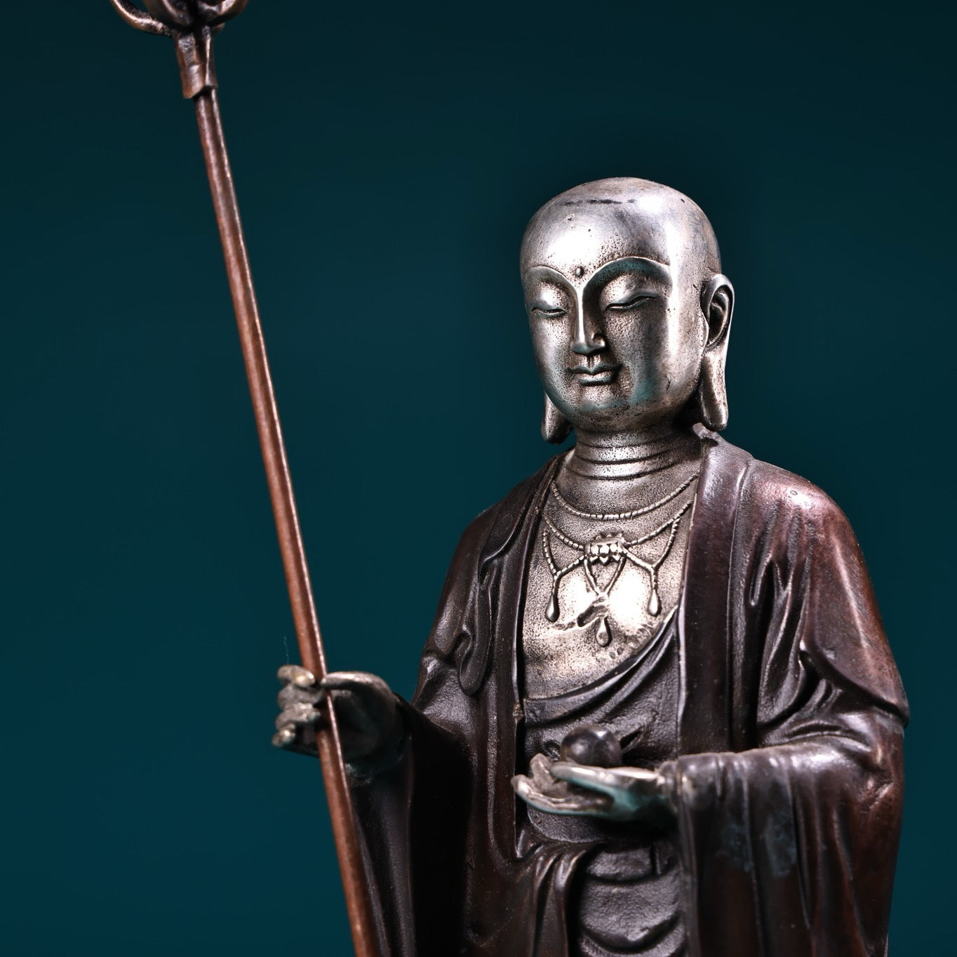A pure copper high relief carved and gilded silver statue of the Ksitigarbha Bodhisattva