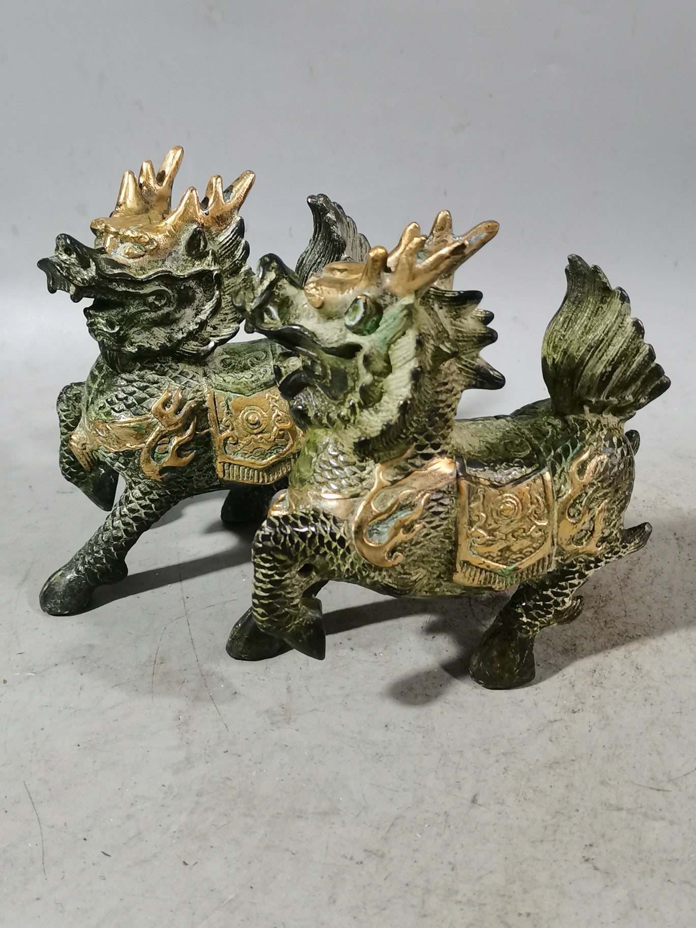 A pair of Chinese antique chubby qilin