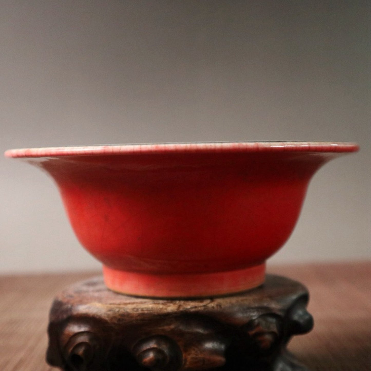 Small bowl with blue, white, and red glazed branches and lotus patterns