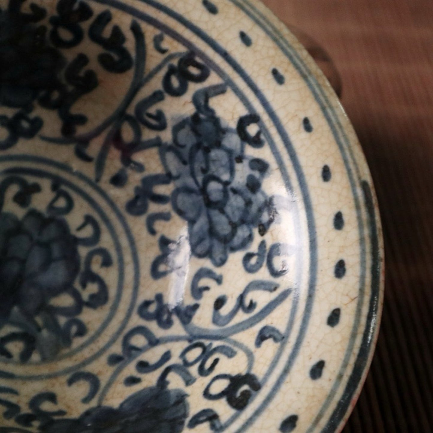 Small bowl with blue, white, and red glazed branches and lotus patterns
