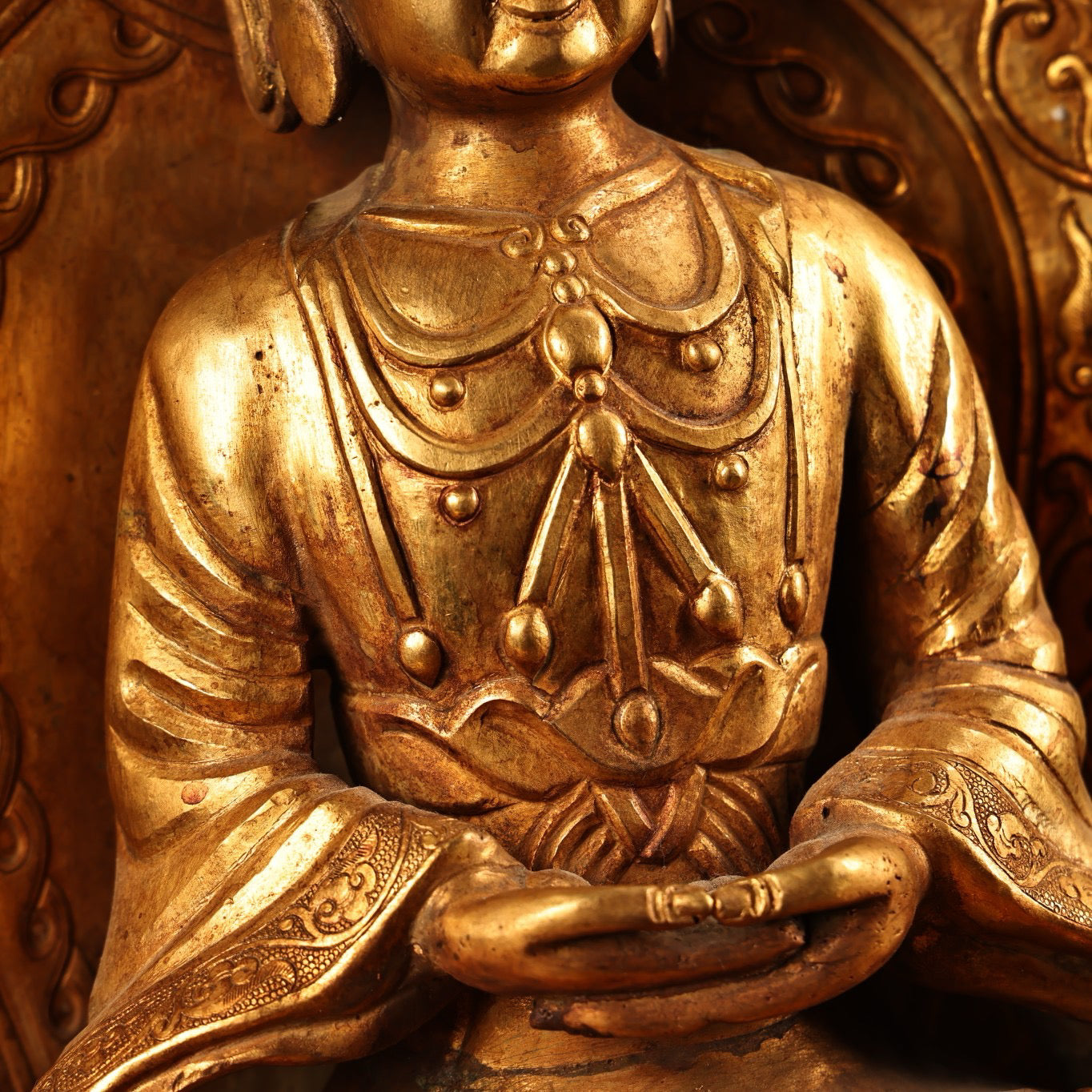 A Chinese antique pure copper high relief carved with gilded immeasurable longevity Buddha