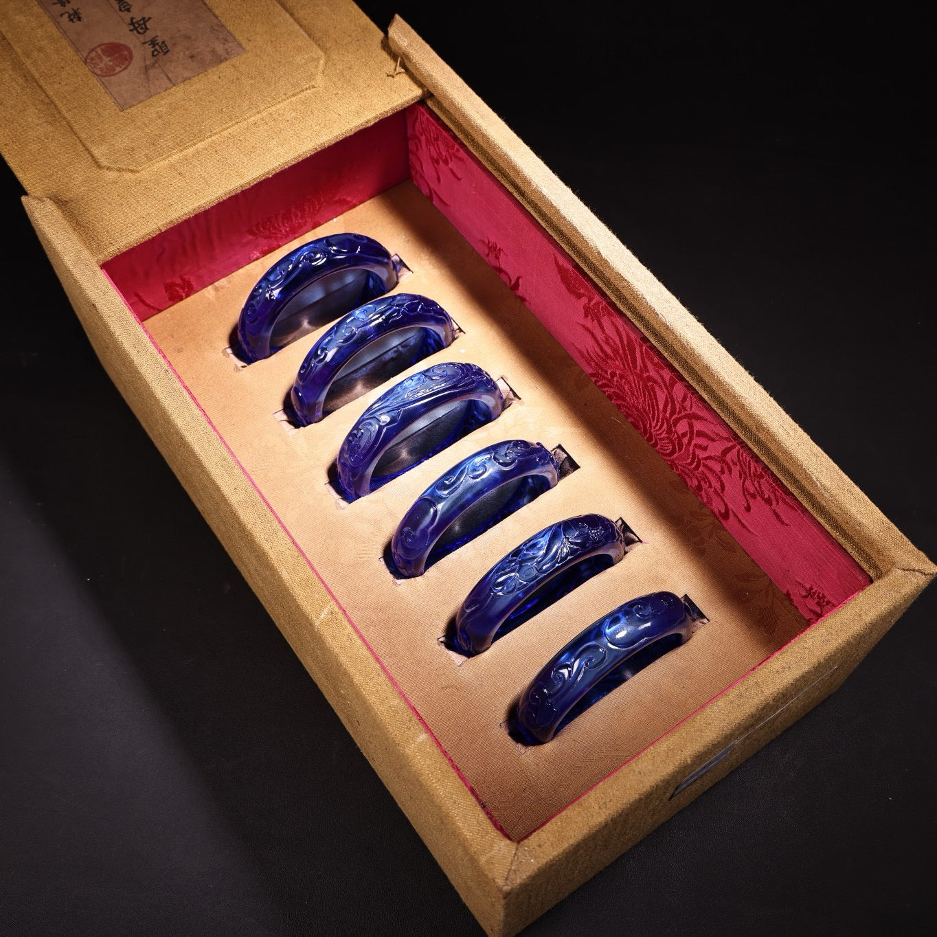 A box of Chinese antique high relief sapphire bracelets