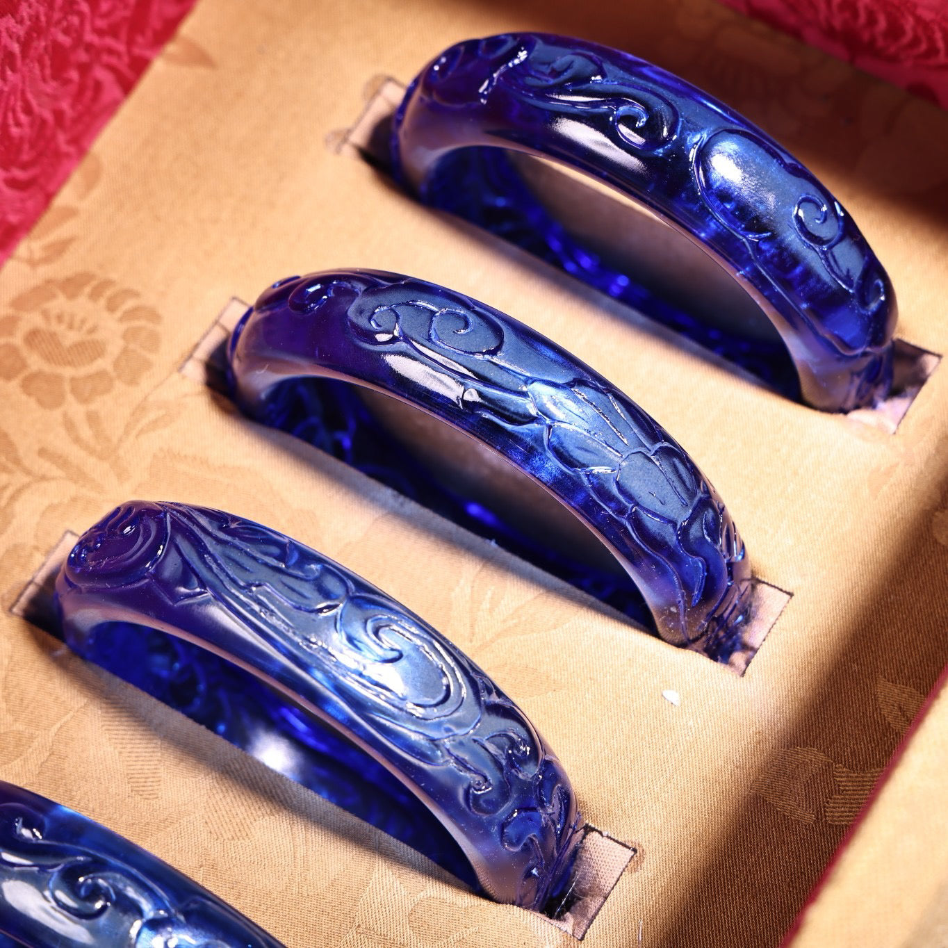 A box of Chinese antique high relief sapphire bracelets