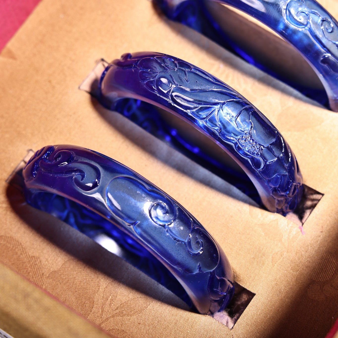 A box of Chinese antique high relief sapphire bracelets