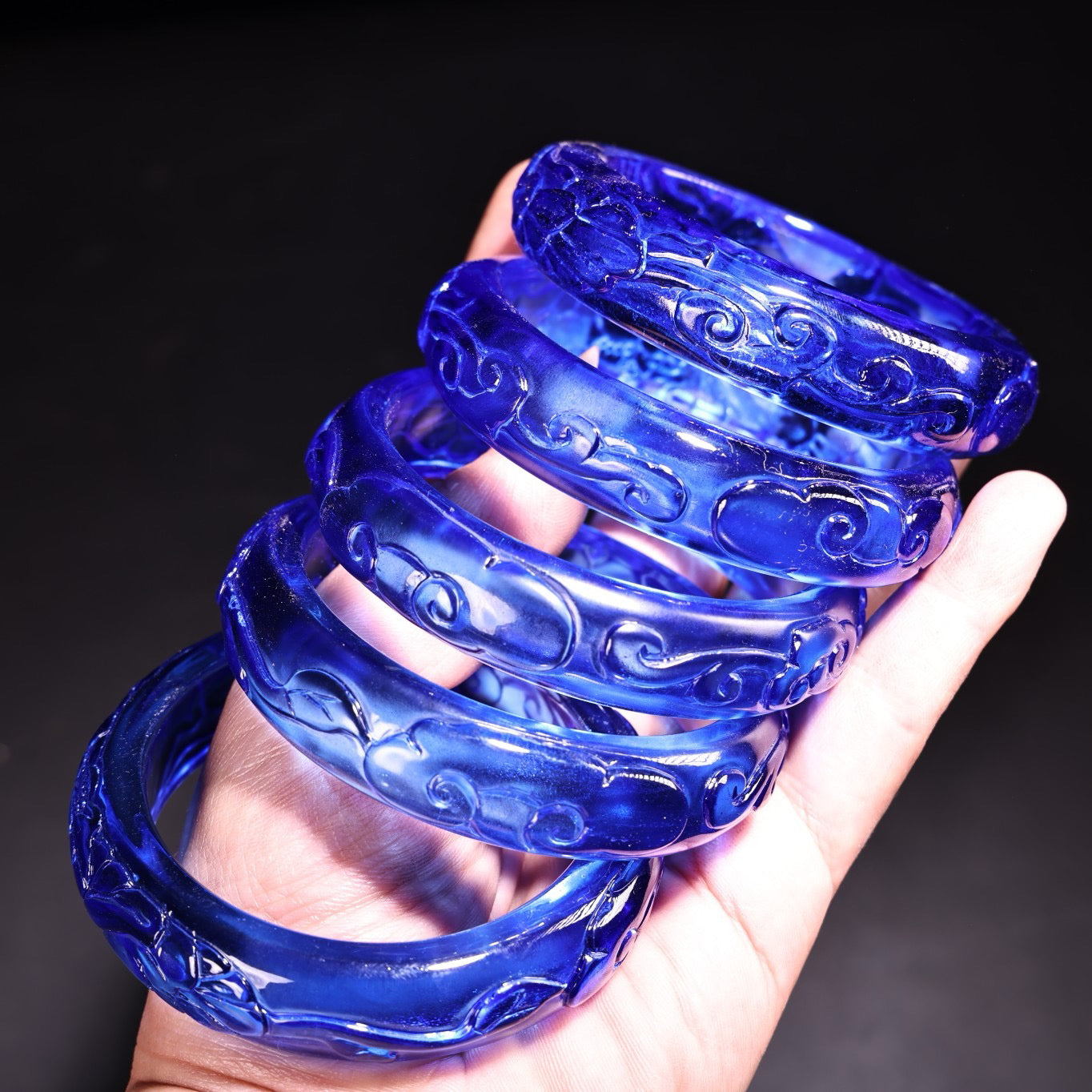 A box of Chinese antique high relief sapphire bracelets