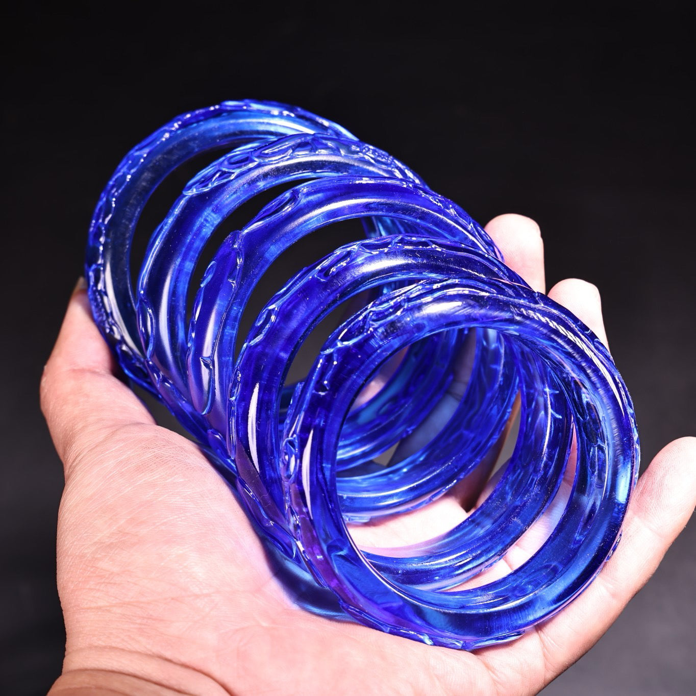 A box of Chinese antique high relief sapphire bracelets