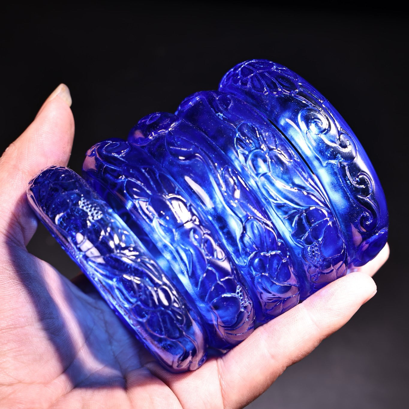 A box of Chinese antique high relief sapphire bracelets