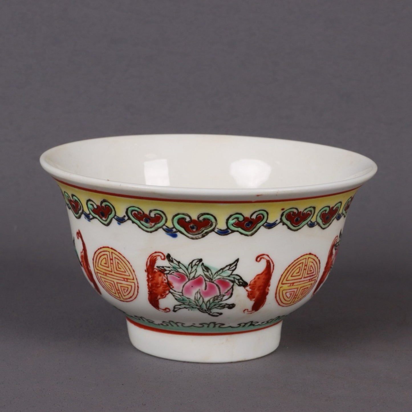 A pair of pink longevity patterned bowls