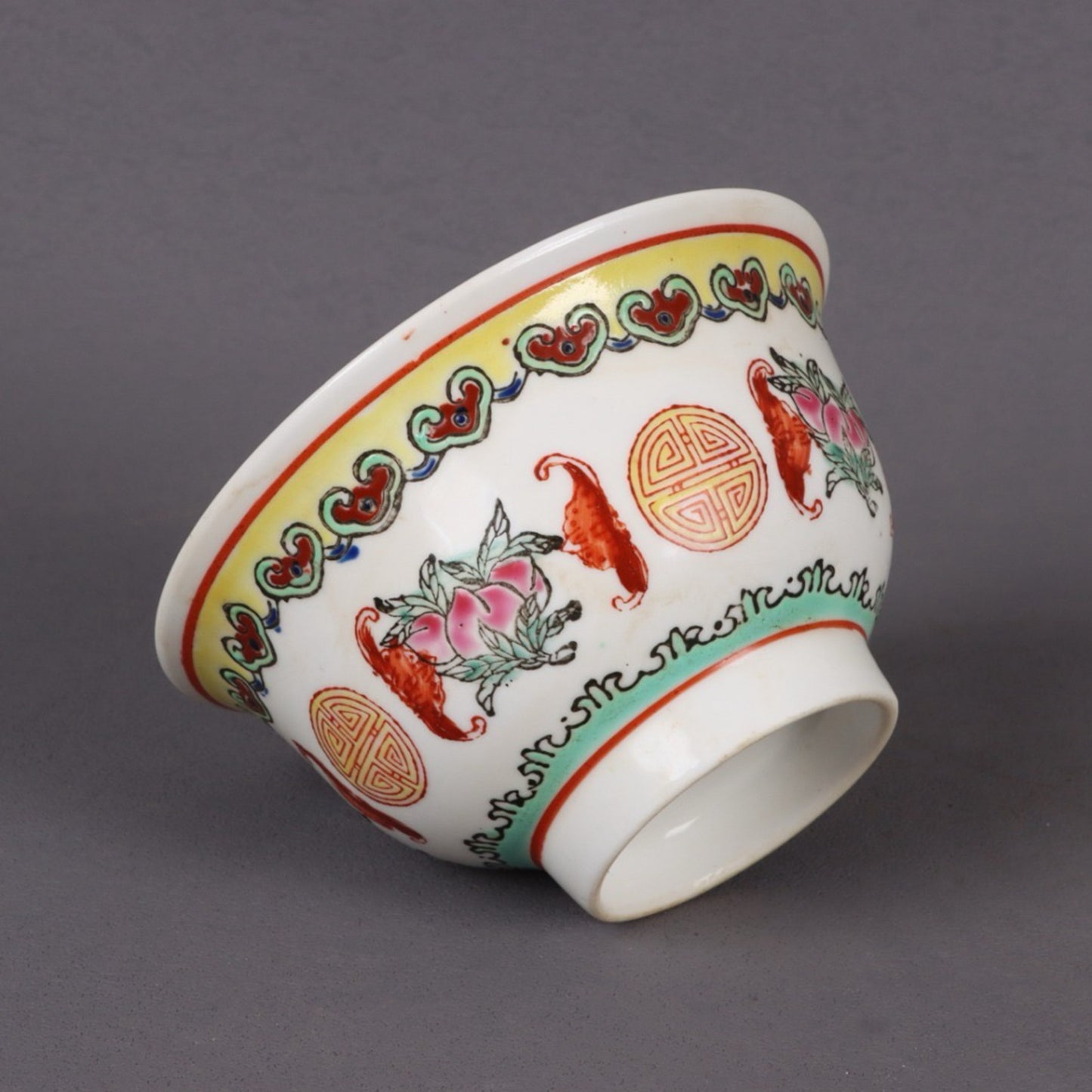 A pair of pink longevity patterned bowls