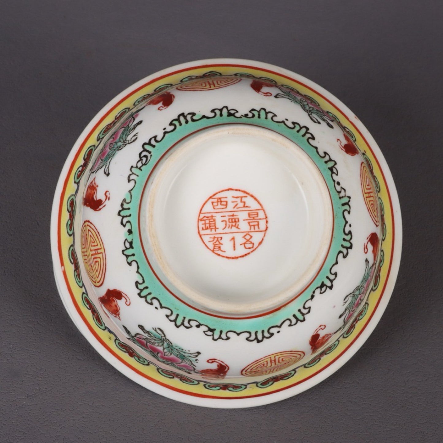 A pair of pink longevity patterned bowls