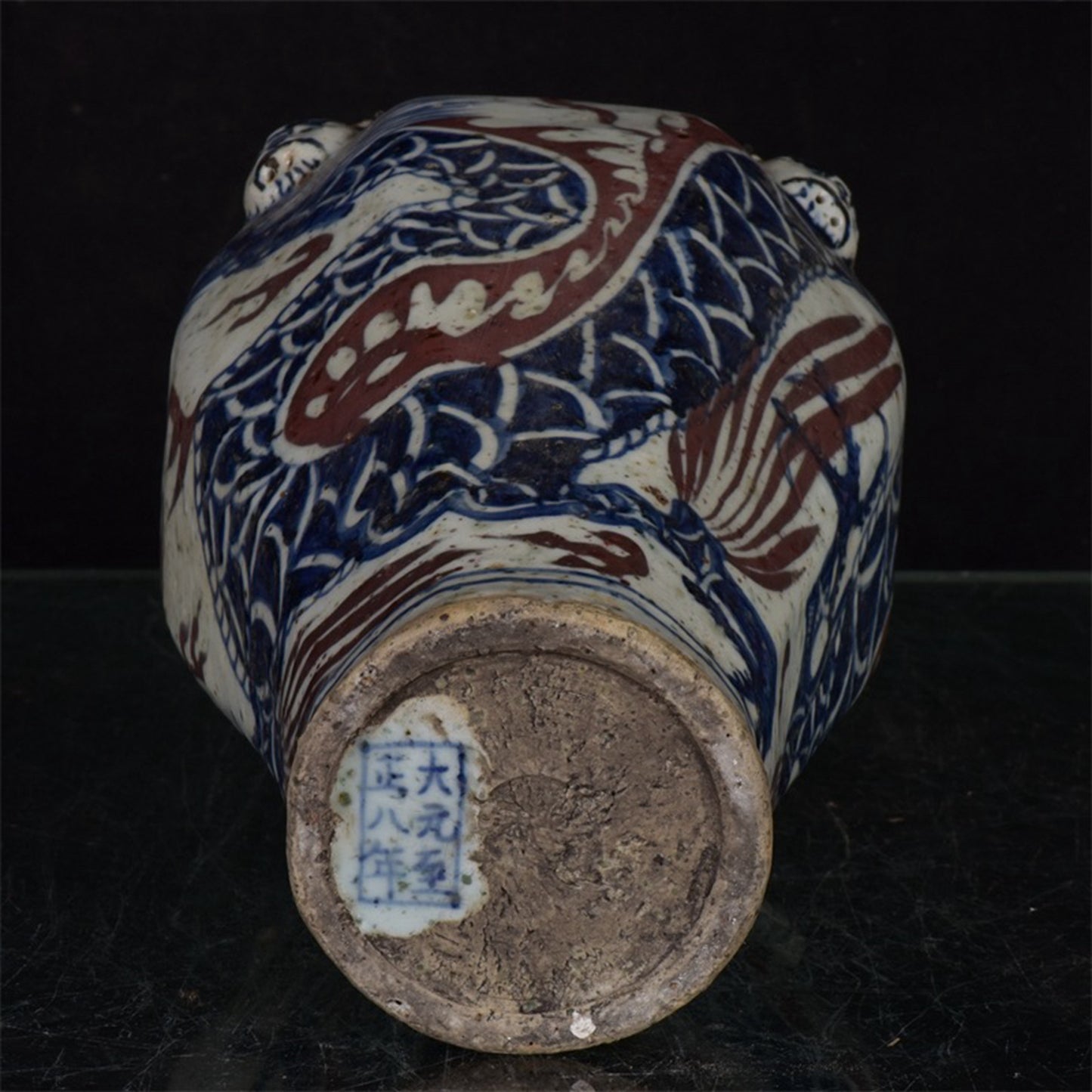 Chinese antique blue and white glazed red dragon patterned silk lion head plum vase