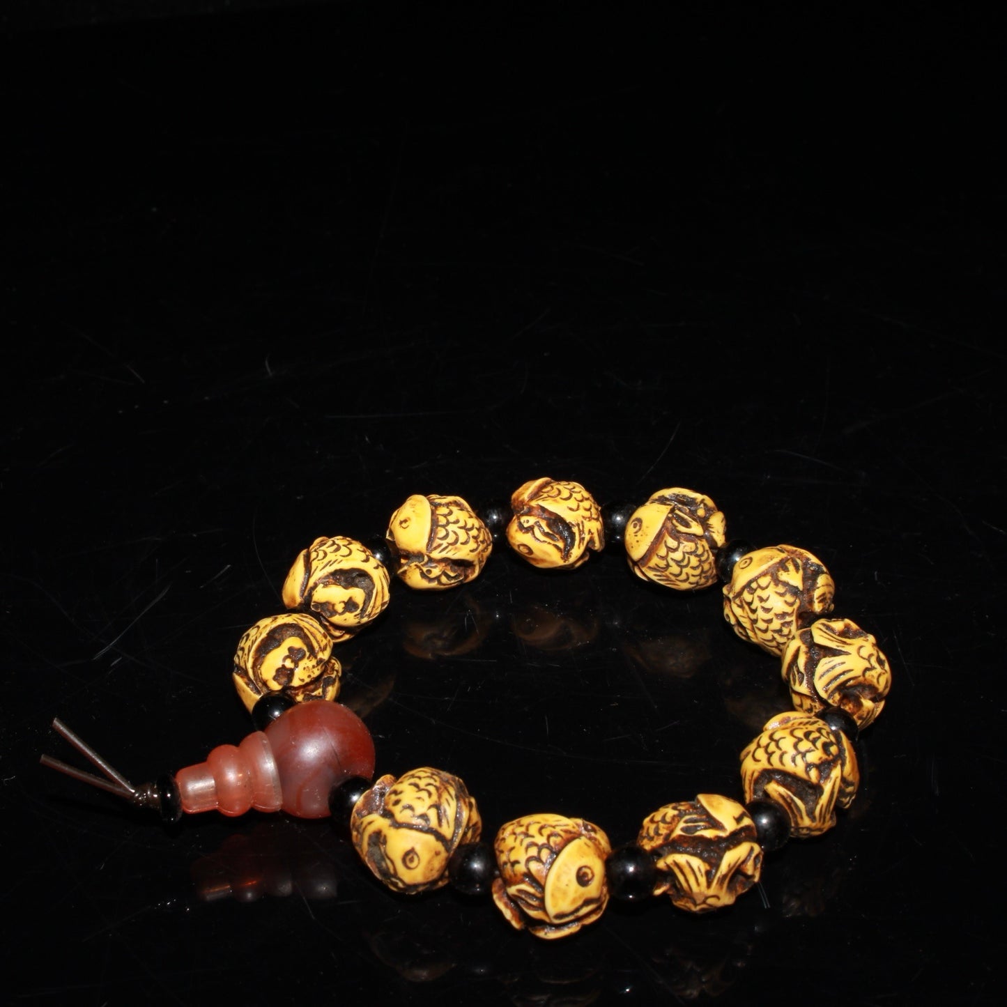 Early collection of ox bone carvings, annual fish bracelet ornaments