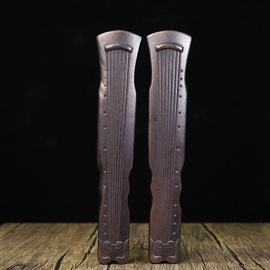 A pair of Huali wood carved Guqin weights and rulers