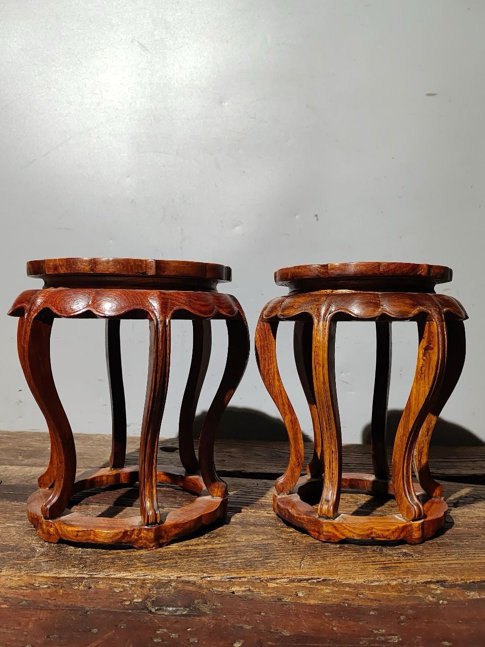 A pair of Chinese antique rosewood bent leg flower rack ornaments