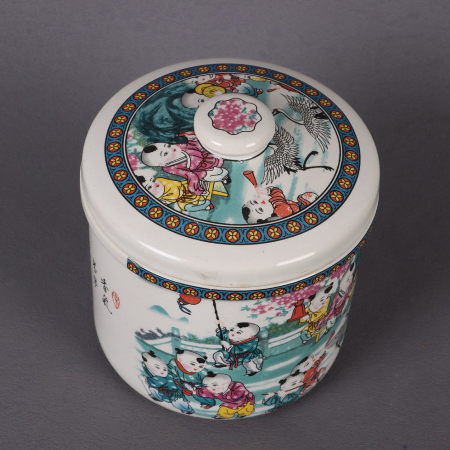 A pair of pink baby scenes and covered jars