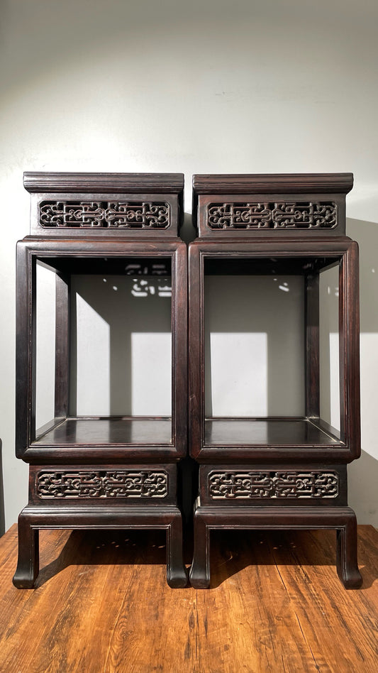 A pair of rosewood flowers