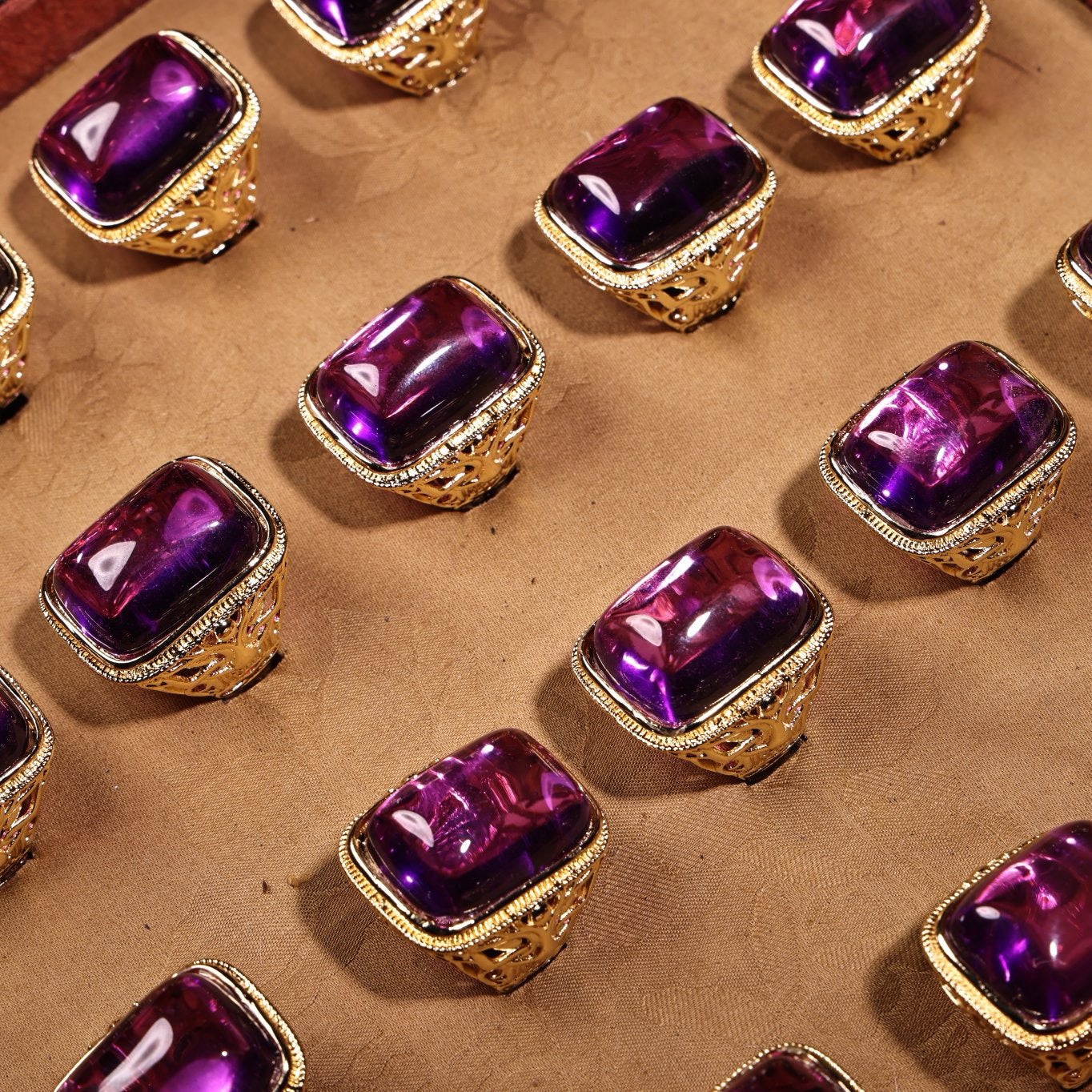 A box of Chinese antique purple gemstone rings
