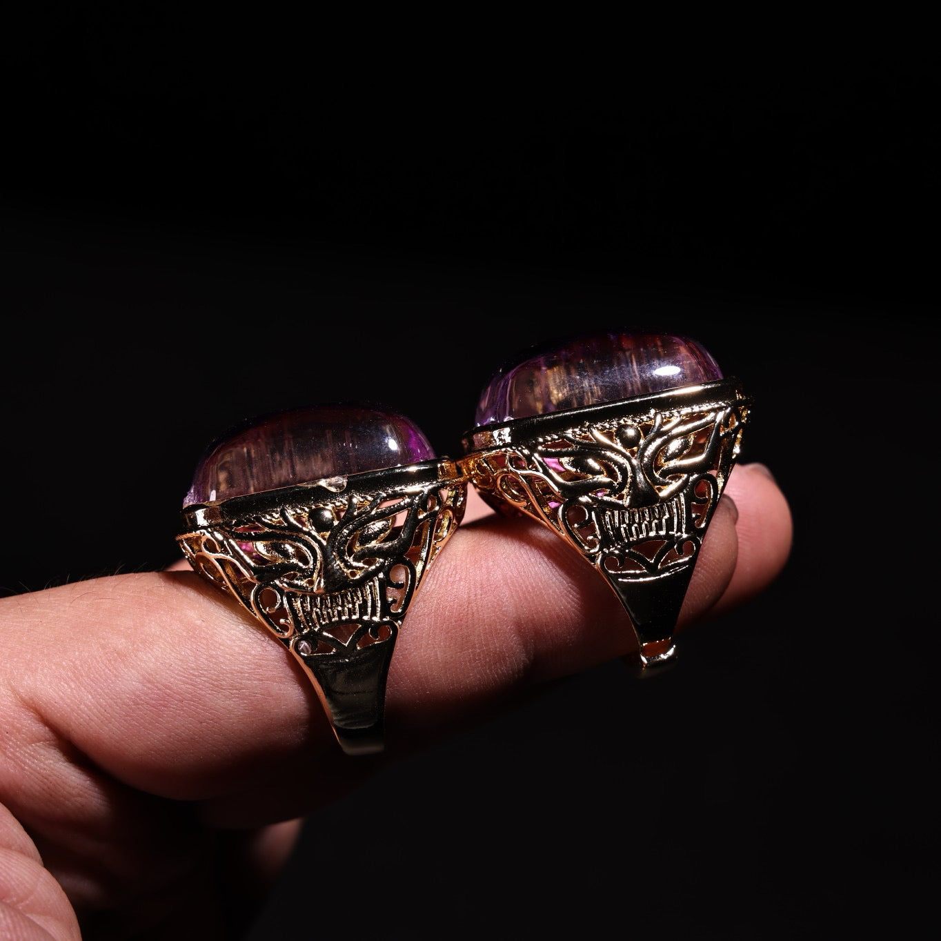 A box of Chinese antique purple gemstone rings