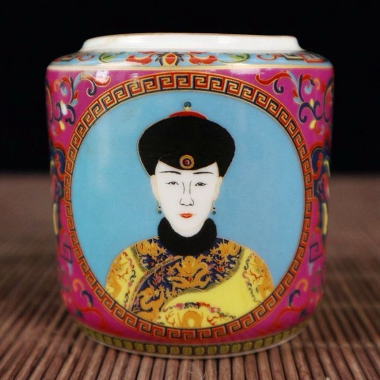 A pair of enamel colored figure patterned lid jars