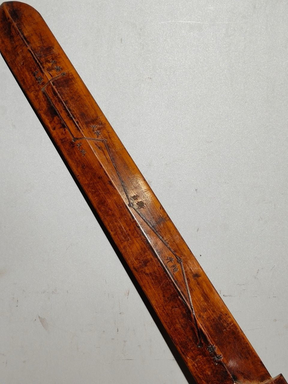 A solid wood carved sword