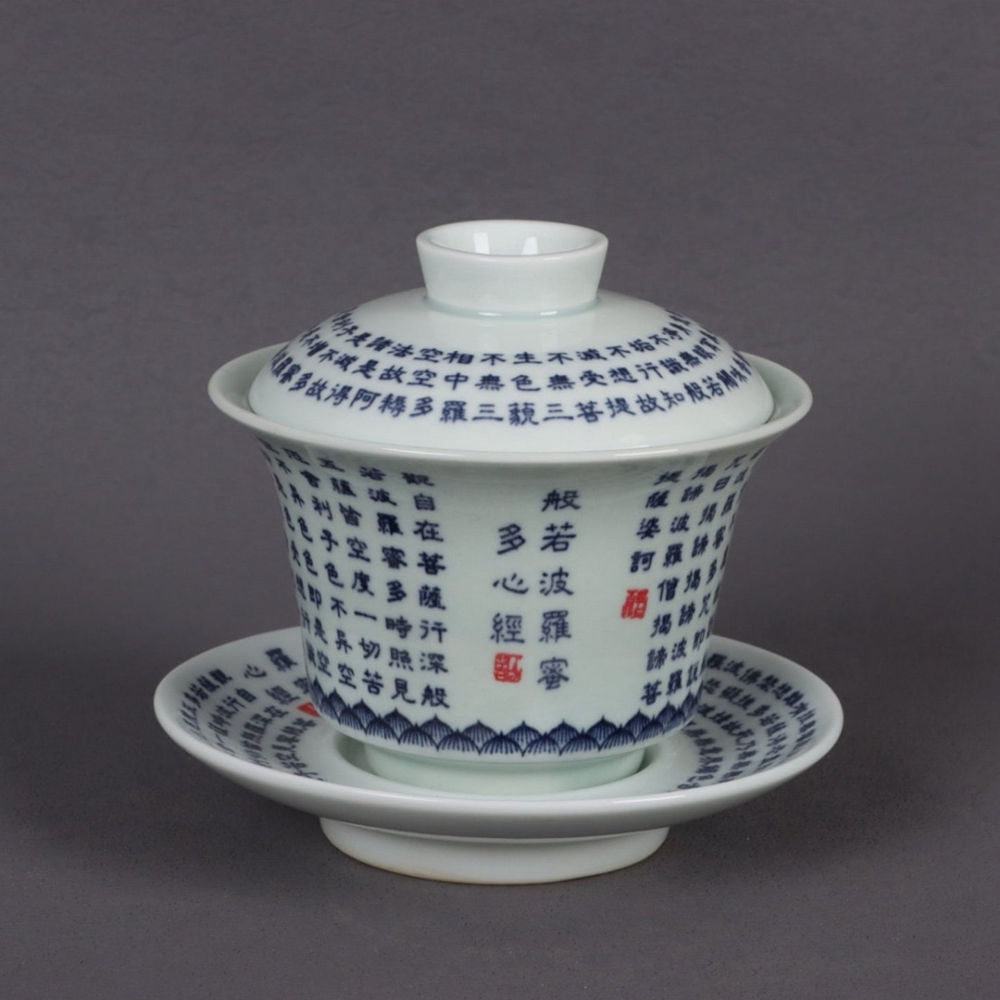 A pair of ceramic blue and white glazed covered bowls