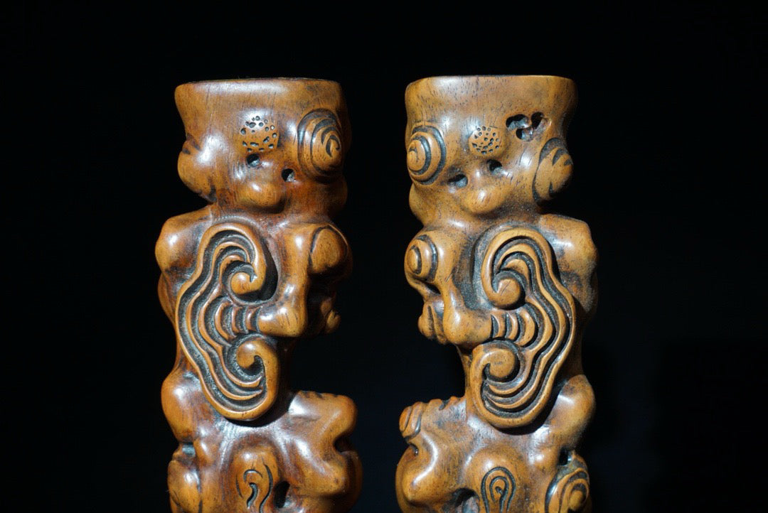 A pair of rosewood carved Ruyi weighing scales