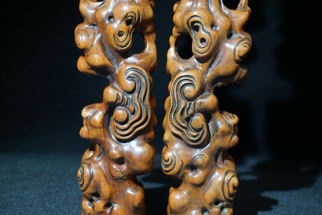 A pair of rosewood carved Ruyi weighing scales