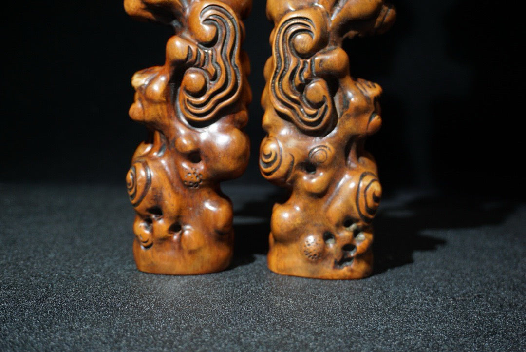 A pair of rosewood carved Ruyi weighing scales