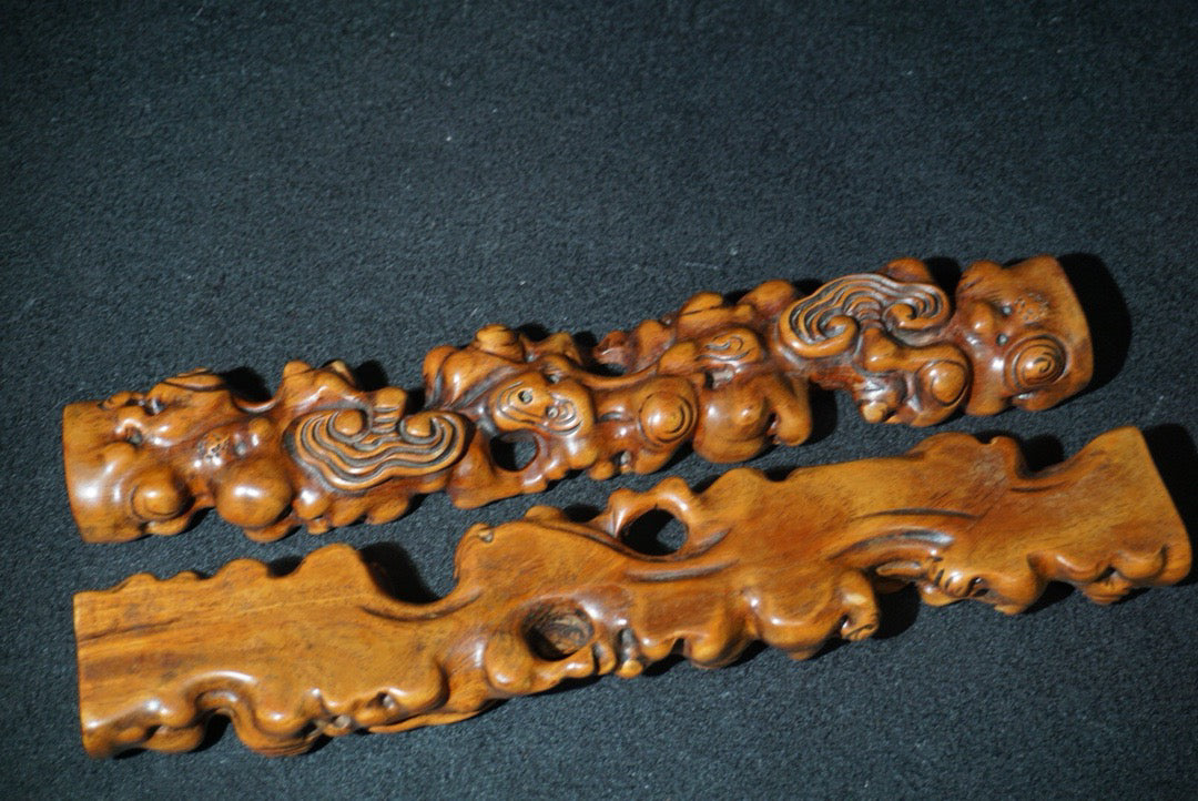 A pair of rosewood carved Ruyi weighing scales