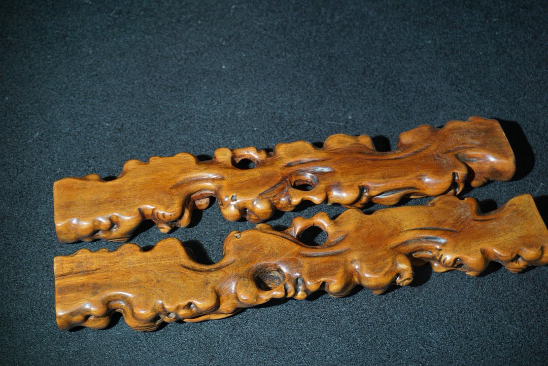 A pair of rosewood carved Ruyi weighing scales