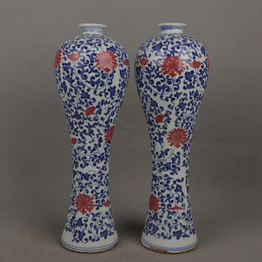 A pair of ceramic blue and white glazed plum blossom vases