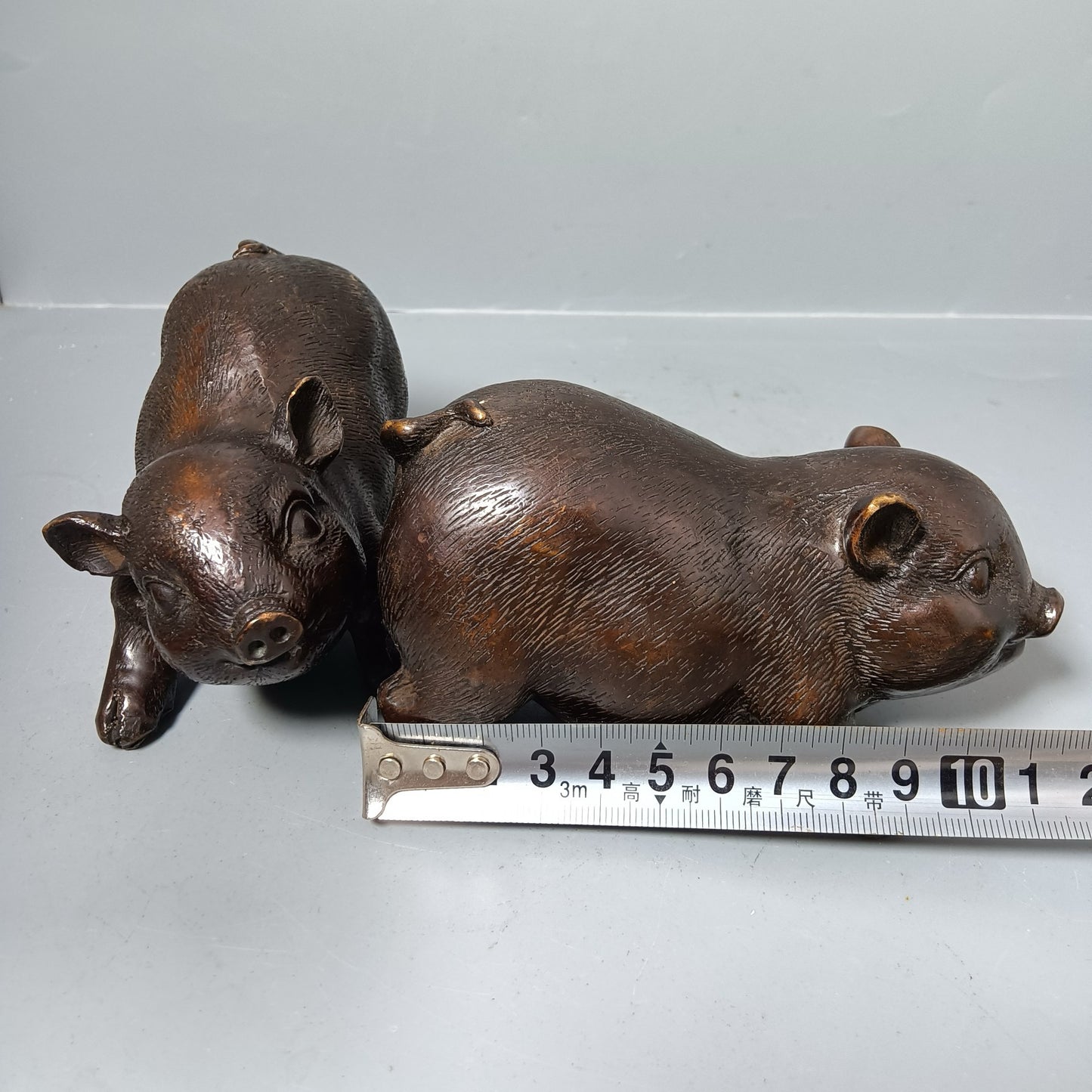 A pair of Chinese antique pure copper pigs